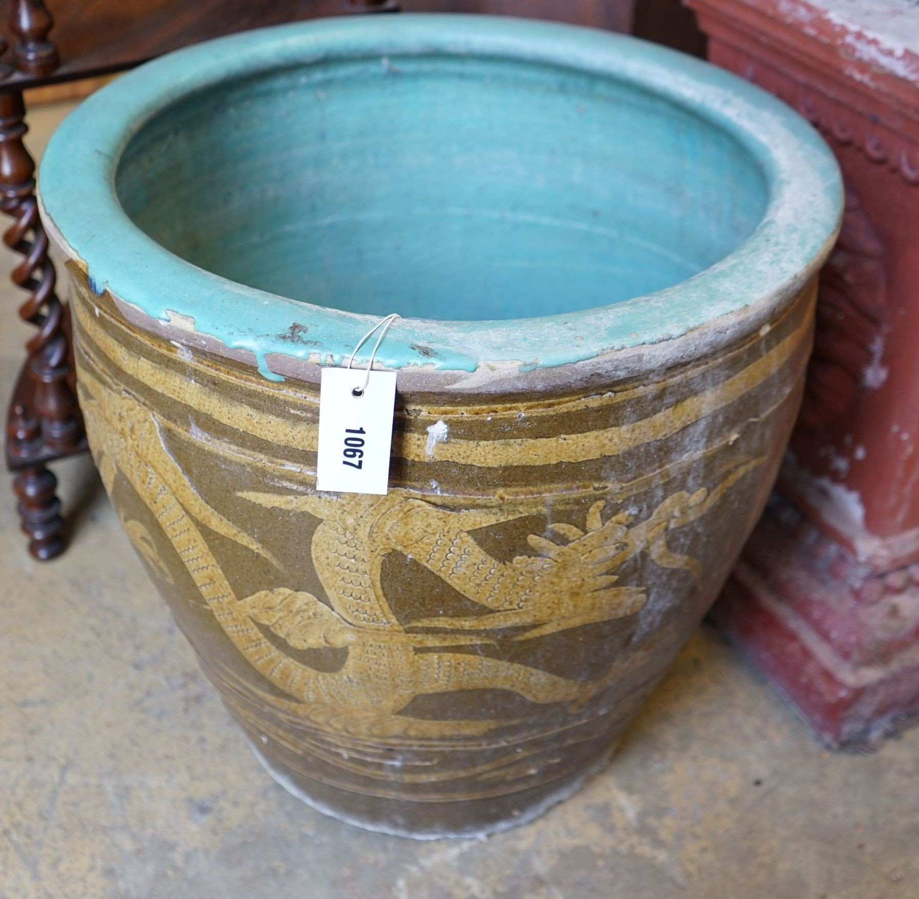 A circular Chinese style glazed earthenware garden planter, diameter 50cm height 50cm.